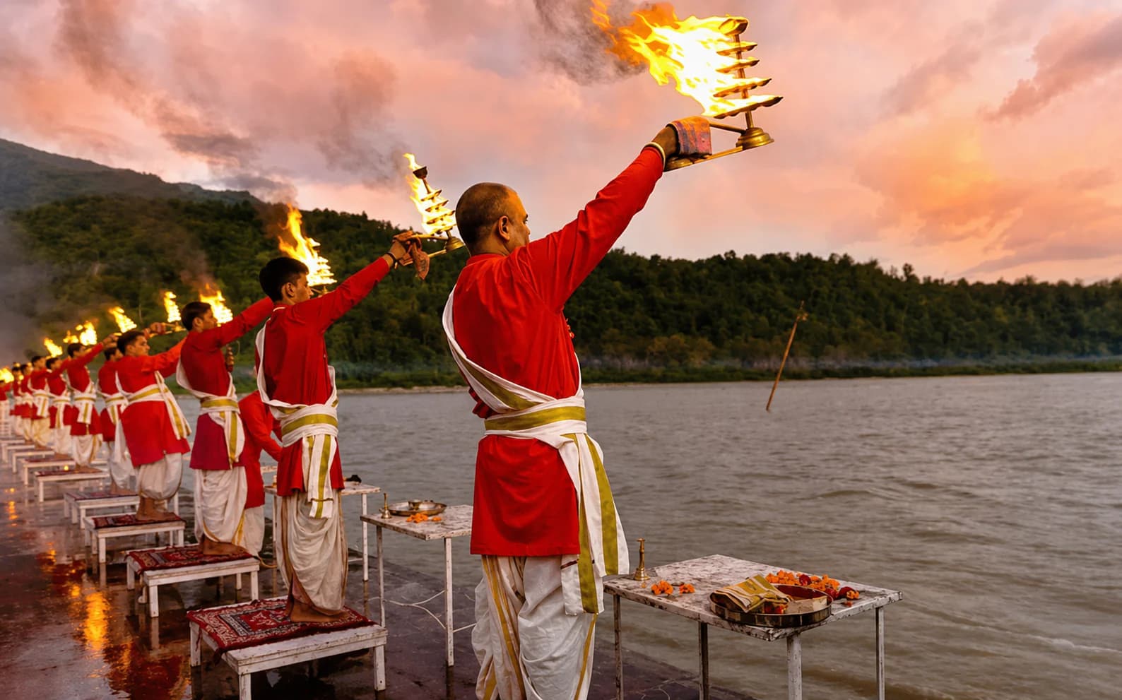 Priests performing the sacred Narmada Aarti ceremony at sunset
